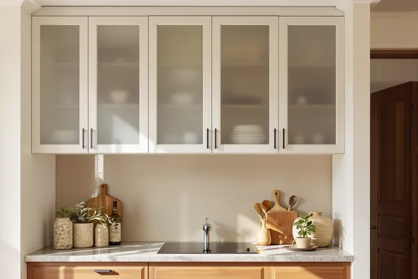 Kitchen Cabinet Uppers — glass interiors for a 2BHK home