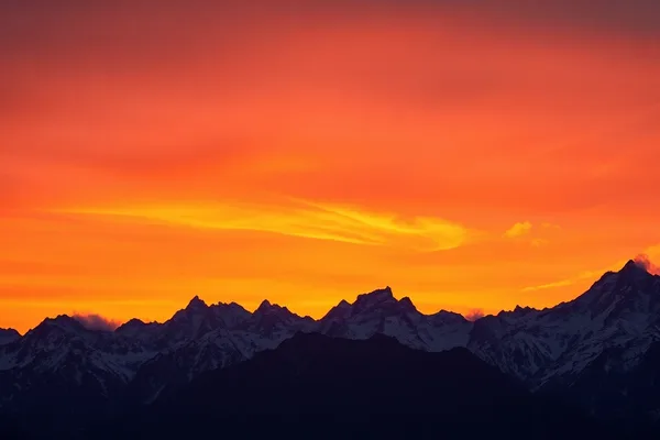 Sunset Over Snow-Capped Peaks