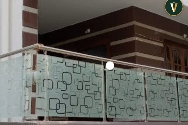 A glass balcony railing with a black frame.